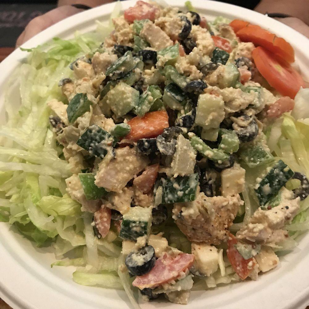 Chopped Salad · Bell peppers, cucumbers, tomatoes, artichoke hearts, black olives & mozzarella cubes on a bed of iceberg with our Mustard Dijon dressing. Served on a 