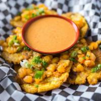 Tostones · [5 pieces] Twice fried green plantains topped with pineapple salsa and scallions served with...