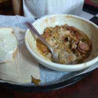 Red Beans and Rice · Slow cooked red beans with yellow onion, smoked sausage and Cajun spices. Served over a bed ...