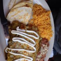 Skirt Steak Taco and Chicken Enchilada Combo · Served with rice and beans. 