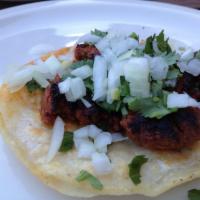 Chorizo · Mexican sausage. Comes with beans, lettuce, tomato, sour cream, cheese and guacamole. 