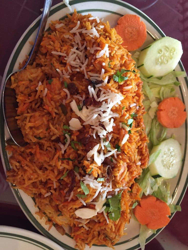 Chicken Biryani · Aromatic basmati rice mixed with boneless chicken, cooked with delicately spiced including saffron, exotic sauce, and herbs. Served with our special raita.