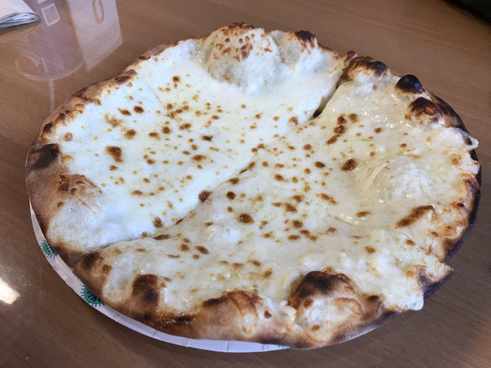 Cheese Manakeesh · Our special flat dough, topped with blended imported cheese. Vegetarian.