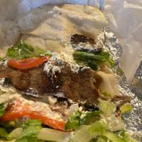 Beef Gyro Wrap · Grilled strips of beef and lamb, with lettuce, tomatoes, onions and tzatziki dressing.