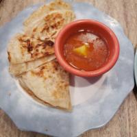 Roti Canai · Our trademark Malaysian pancake is perfectly doughy and flakey just right for dipping into o...