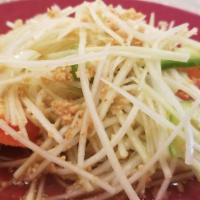 Green Papaya Salad · This national dish of Thailand is made of fresh green papaya, green peppers, and sweet red p...