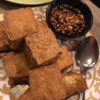 Crispy Tofu Salad · We take our garden salad to the next level by topping it with generous blocks of our homemad...