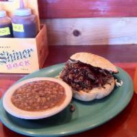 Mr. Brisket Sandwich · Smoked for up to 17 hours and topped with coleslaw and BBQ sauce.