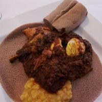 Chicken Doro Wot · Tender chicken, red pepper sauce, spices served with a hard-boiled egg.