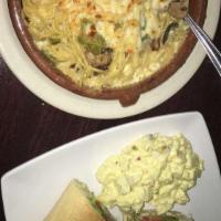 Carbonara · Bacon, green peppers, sauteed mushrooms, Parmesan cheese, creamy white sauce topped with mel...