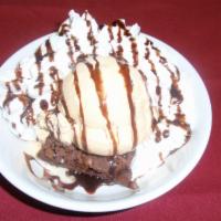 Brownie a La Mode · Warm homemade brownie with a side of French 
vanilla ice cream, whip cream and chocolate syr...