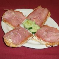 Bruschetta · Prosciutto ham, tomato, feta cheese, extra virgin olive oil and oregano on toasted bread.