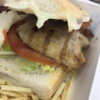 Cuban Chicken Club Sandwich · Served with potato sticks.
