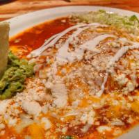 Stacked Chicken Enchiladas · Roasted chicken and shredded cheese layered between corn tortillas. Topped with enchilada sa...