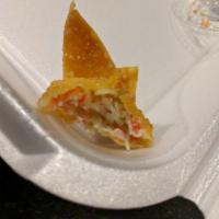 Crab Rangoon · Deep fried wonton stuffed with imitation crabmeat served with plum sauce.