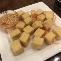 Fried Tofu · Deep fried tofu served with sauce and crushed peanut.