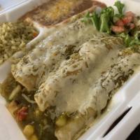 Enchiladas · Topped with cheese, sour cream and choice of green or creamy jalapeno.