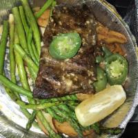 Steak Velasco · Marinated NY Strip steak sautéed with garlic, white wine and jalapenos. Served with fingerli...