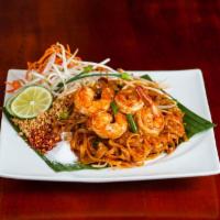 Pad Thai Noodle · Traditional rice noodles with egg, bean sprouts, green onions, fried tofu, carrots, and chop...