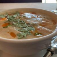Tom Kha Soup · Traditional Thai coconut lemongrass soup with chili paste, coconut milk, galangal, lime, oni...