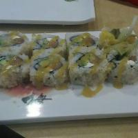 Mango Philly Roll · Salmon, super white tuna, cream cheese, avocado, cucumber inside. Crunch on top. Finished wi...