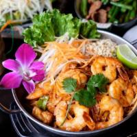 Pad Thai · Pan-fried thin rice noodles with egg, tofu, bean sprouts and ground peanut in delicately fla...