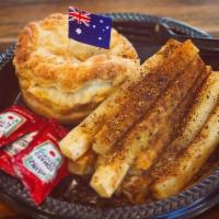Aussie Style Meat Pie · Tender braised choice beef stewed in mild thyme gravy in own short crust pastry. Served with...
