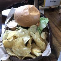 The Plain Jane Burger · Ol' fashioned burger with cheddar cheese, lettuce, tomato and onion. Served with kettle chip...