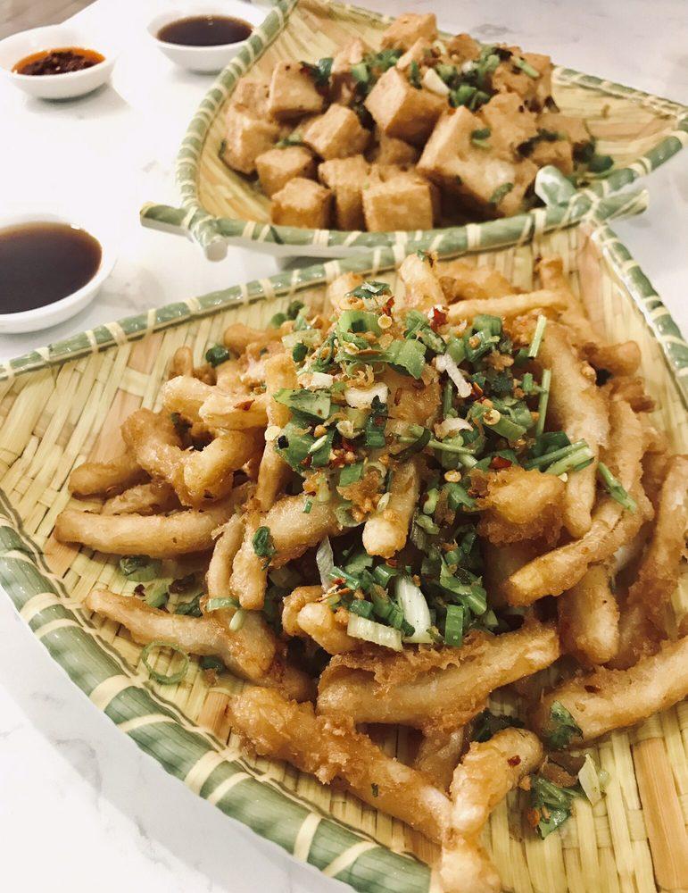 Salt and Pepper Squid · Crispy squid with diced chili pepper, cilantro, scallion, fried garlic in salt and pepper mix. Spicy.