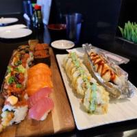 Lion King Roll · In: real crab and avocado. Out: baked salmon with house special sauce.
