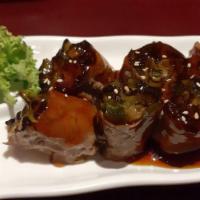 Beef Negimaki · Grilled and sliced beef rolled with scallions in teriyaki sauce.