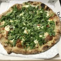 The White Album Pizza · Bechamel sauce, Pecorino, Ricotta, Provel, Roasted Garlic topped with Arugula.