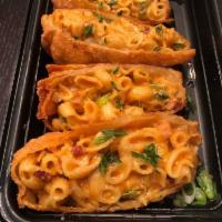 Mac and Cheese Egg Rolls · 4 cheeses with bacon. Rolled, wrapped and fried. Served with sweet chili sauce. 2 Egg Rolls ...