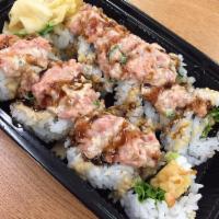 Dragon Maki · 8 pieces. Shrimp tempura, lettuce, teriyaki sauce, sesame seeds, ground ahi, green onion. To...