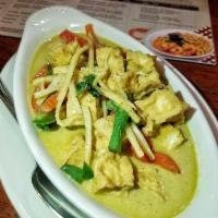 Green Curry · Hot and spicy. Green curry paste, coconut milk, bamboo shoots, green beans, bell peppers and...