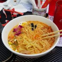 BBQ Chicken Ramen · Noodles topped with BBQ chicken, scallions, carrots, corn, egg, edible flowers, sesame seeds...