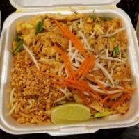 Pad Thai · Skinny rice noodles pan fried with egg, bean sprouts, and green onions, garnished with groun...