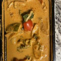 Panang Curry · Served with coconut milk, red and green bell peppers with basil leaves. Prepared medium spicy.