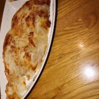 Roti · Pan-seared roti with Massaman dip.