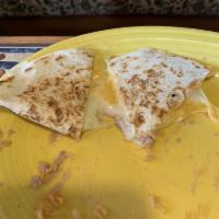 Quesadilla · Large flour tortilla filled with melted cheese and your choice of 1 protein. Topped with tom...