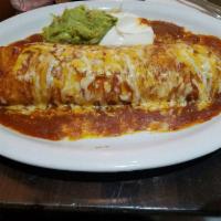 Deluxe Machaca Burrito · A large combination burrito with shredded beef and beans, smothered with sauce and melted ch...