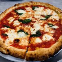 Margherita Pizza · Mozzarella, tomato sauce and basil.