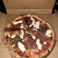 Cavani Pizza · Speck, sausage, spicy salami, mozzarella, tomato sauce and basil.