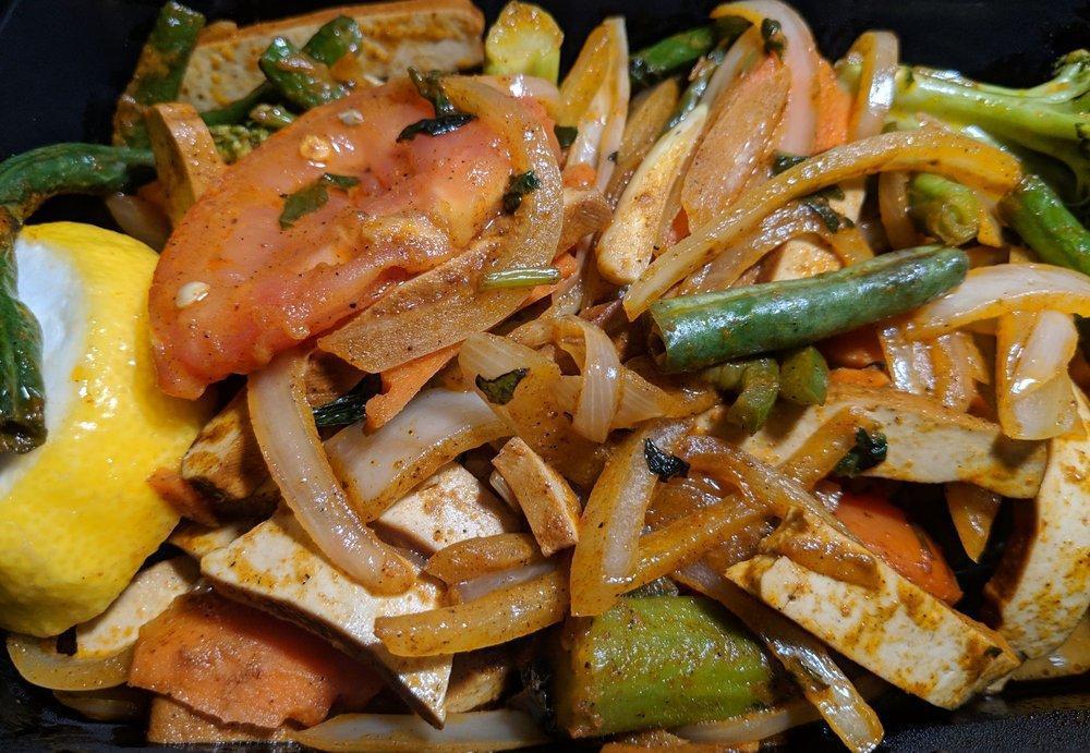 Kebat · Wok stir-fried with tomatoes, onions, masala, paprika and tamarind juice.