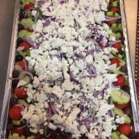 Greek Salad · Mixed greens, tomatoes, cucumbers, Kalamata olives, red onion, feta, and Greek dressing.