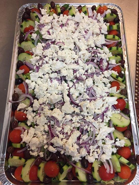 Greek Salad · Mixed greens, tomatoes, cucumbers, Kalamata olives, red onion, feta, and Greek dressing.