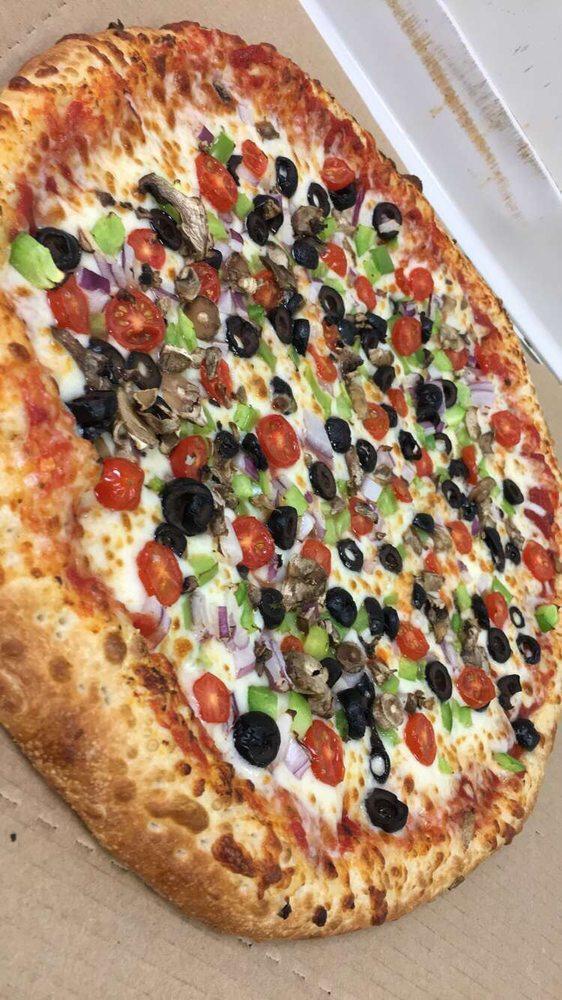 Central Park Veggie Pizza · For the light weights! green pepper, onion, black olive, mushroom, diced tomato, Wisconsin whole milk mozzarella, and our traditional pizza sauce.