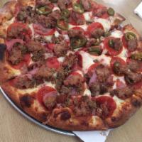 Meat Lovers Pizza · Pepperoni, ham, bacon, ground beef, and Italian sausage.