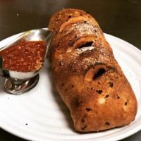 Stromboli · Pepperoni, sausage, mushrooms, onions, green peppers and cheese. Served with marinara sauce.