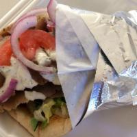 Gyro Sandwich · Sliced grilled gyro, served on Greek pita bread, topped with lettuce, parsley, tomato, onion...